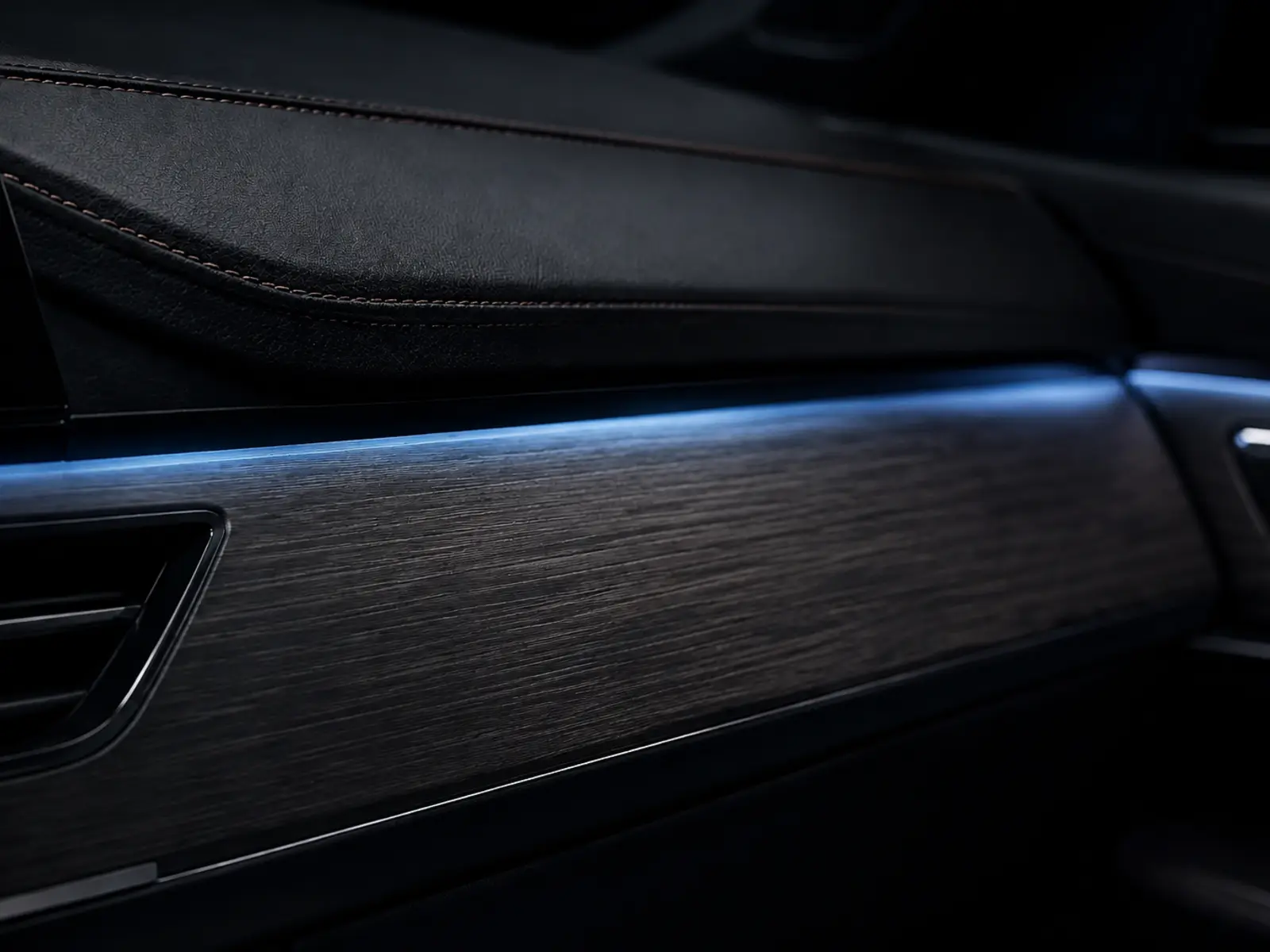 Subtle cool light diffused across dashboard trim
